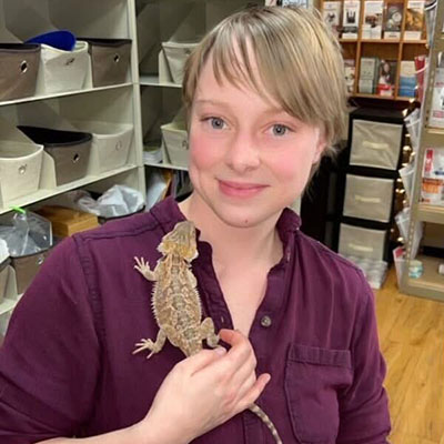 slider-9 A tech with a lizard at Pikes Peak Veterinary Clinic, Colorado Springs.